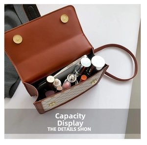 Internal view of the vintage contrast bag showing high capacity for phone and cosmetics