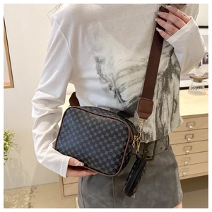 Detail of grey crossbody bag with vintage pattern, wide strap and mini round pouch