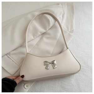 Chic cream PU leather shoulder bag with silver bow accent and minimalist curved design