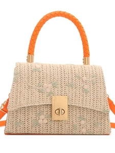 Beige woven crossbody bag with pink floral embroidery and bright orange top handles