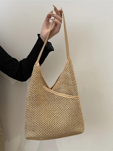 Handwoven straw tote bag with premium leather trim for casual summer vacation style