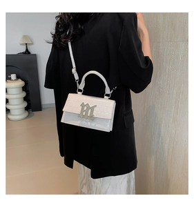Detail of white crocodile texture mini bag with silver RL gothic metal lettering