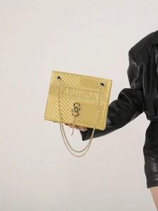 Golden V-quilted chain shoulder bag with tassel and metal logo in a luxury finish
