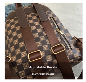 Detailed view of adjustable shoulder strap and gold hardware on checkered backpack