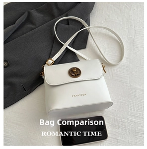 Detail view of white PU leather crossbody bag with vintage bronze buckle and shoulder strap