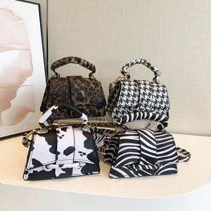 Trapezoid mini handbags in leopard, houndstooth, cow and zebra prints with top handles