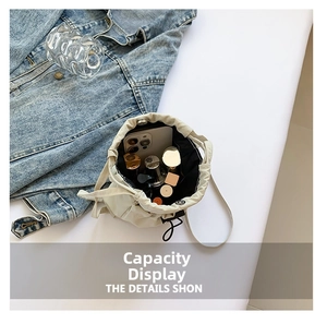 Top view of nylon drawstring bucket bag showing internal capacity for makeup and phone