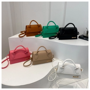 Six different colors of trapezoidal mini handbags displayed on white stairs with logo detail