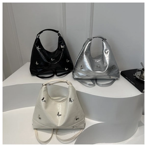 Three PU leather hobo bags in black, silver, and white with silver butterfly metal accents