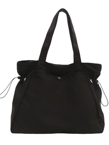 Large black canvas tote bag with shoulder straps and adjustable side drawstrings