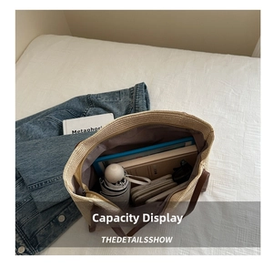 Top view of woven straw tote bag showing large capacity with daily essentials inside