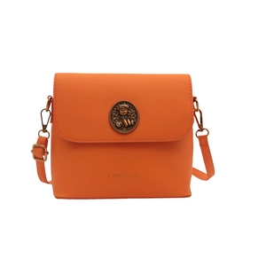 Orange leather crossbody bag with vintage bear emblem and adjustable shoulder strap