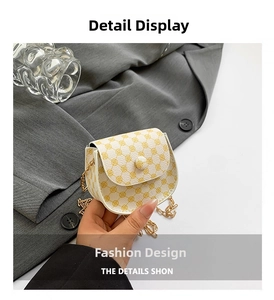 Detailed close-up of a mini flap crossbody bag with white and yellow retro circle patterns