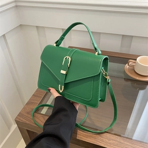 Chic green PU leather crossbody handbag with gold buckle and adjustable strap
