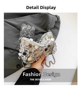 Detail of silver sequined handbag with shimmering round sequins and metal chain strap