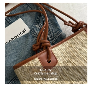 Detailed close-up of straw woven texture with dark brown knotted leather straps