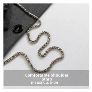 Macro shot of a gunmetal grey metallic chain strap with a sleek polished finish