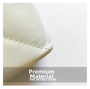 Detailed close-up of quilted beige leather texture and precision stitching on bucket bag