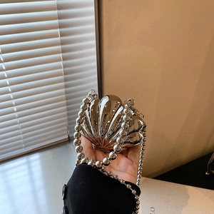 Chic silver metallic shell evening bag with a bead chain strap and mirror finish