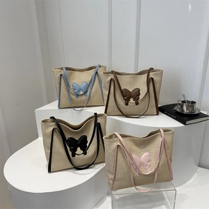 Fashionable straw tote bags with butterfly patches in four colors for summer travel