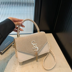 Elegant cream white chain flap bag with rhinestone lettering and metallic tassel pendant