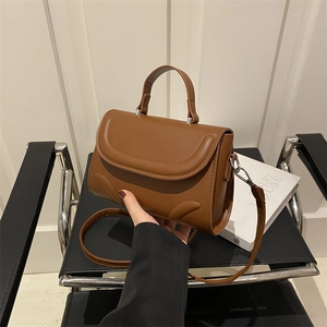 Retro brown crossbody bag for women featuring structured design and fashion bag logo