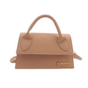 Minimalist apricot trapezoid handbag with gold metal logo and detachable shoulder strap