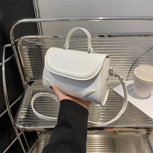 Minimalist white PU leather crossbody bag with embossed lettering and top handle