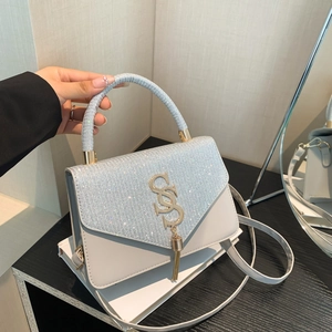 Chic light gray crossbody bag with sparkling glitter flap and gold hardware tassel