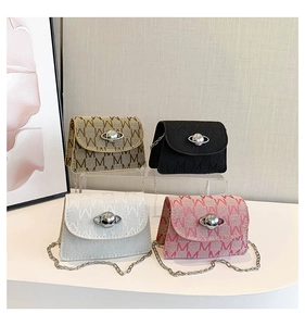 Macro detail of mini crossbody bags with woven M pattern and planet buckle