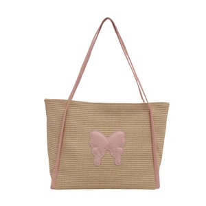 Large summer straw tote bag with pink leather straps and a stylish butterfly patch