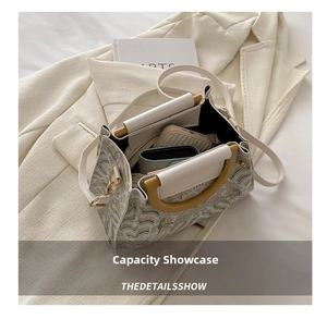 Top-down view of retro bucket bag interior showing capacity for phone and wallet