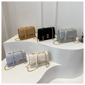 Detailed display of five colorful velvet crossbody bags with gold chain and U-shaped locks