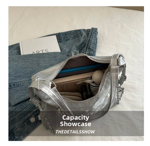 Interior view of large silver tote bag showing capacity for umbrella and wallet