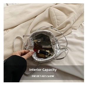 Internal view of the silver drawstring bag showing large capacity for cosmetics