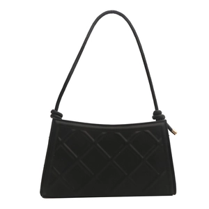 Minimalist black quilted shoulder bag with knot details and golden zipper accents