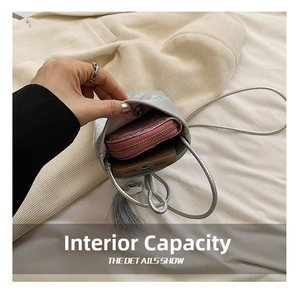 Silver mini crossbody bag interior showing storage for smartphone and wallet