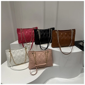 Quilted chain tote bags in five colors featuring classic diamond stitching and gold chain straps