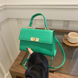 Fashionable green crocodile pattern handbag with gold twist lock for casual daily wear