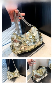 Detailed view of the gold sequin bag with large round discs and silver chain strap