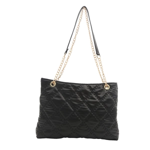 Classic black quilted tote bag with golden chain straps and spacious interior for daily use