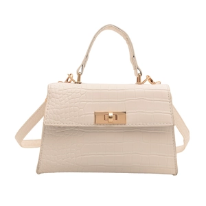 Elegant cream crocodile pattern crossbody bag with golden clasp and structured handle