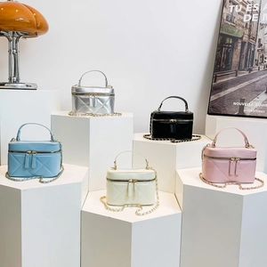 Chic quilted cylindrical handbag set in various colors with metallic chain straps