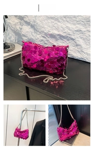 Detail of rose red sequin handbag with metallic chain strap for party fashion
