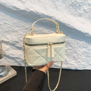 Chic cream quilted chain crossbody bag with classic diamond stitch and gold hardware