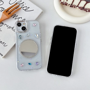 Sparkly transparent iPhone case with colorful gemstones and built-in makeup mirror