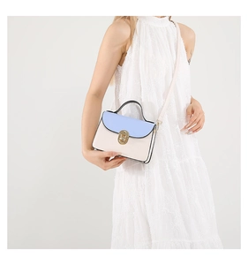 Contrast mini leather crossbody bag shown on model for size and style reference