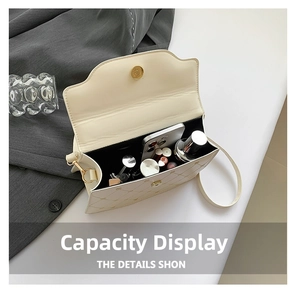 Interior view of quilted crossbody bag showing capacity for phone, lipstick and perfume