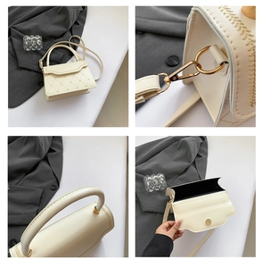 Detail view of cream white crossbody bag showing heart quilting and gold hardware