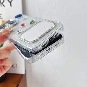 Detail view of iPhone case with glitter finish, colorful gemstones, and a built-in makeup mirror